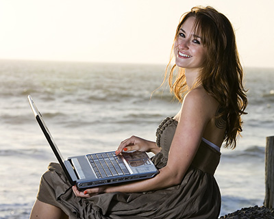 Happy Lady using her laptop